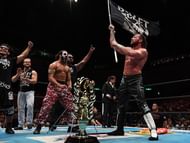 Kenny Omega celebrating his G1 Climax win with The Bullet Club